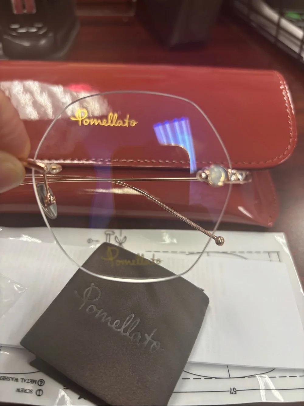 Pomellato Gold Rimless Glasses with Red Case